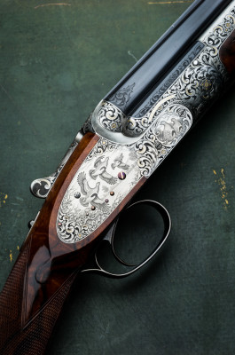 A HARTMANN & WEISS 20g Over and Under Engraved by Alan Brown.