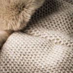Fur Lined Knit Hat With Ear Warmers in Beige